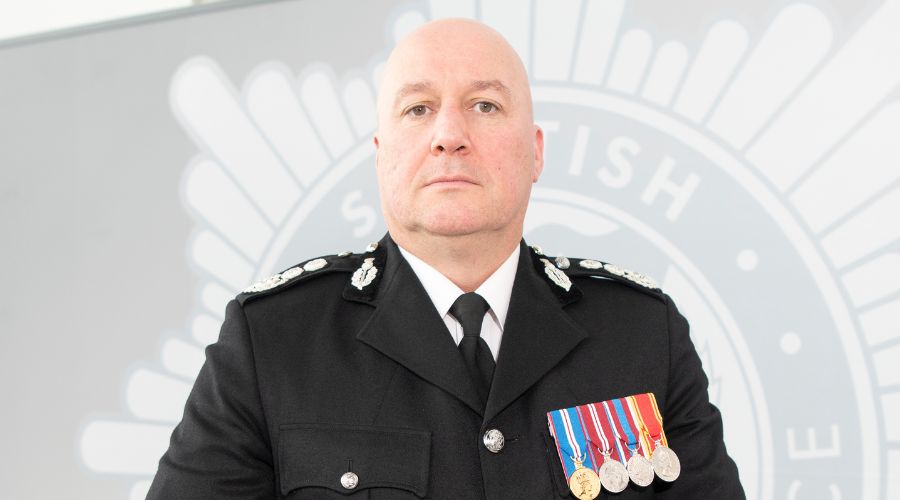 Chief Officer Ross Haggart standing in black uniform