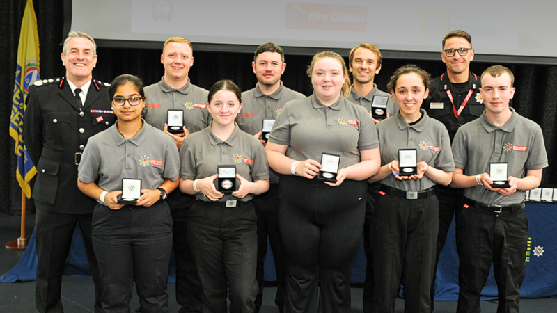 Group of youth volunteers with their awards 