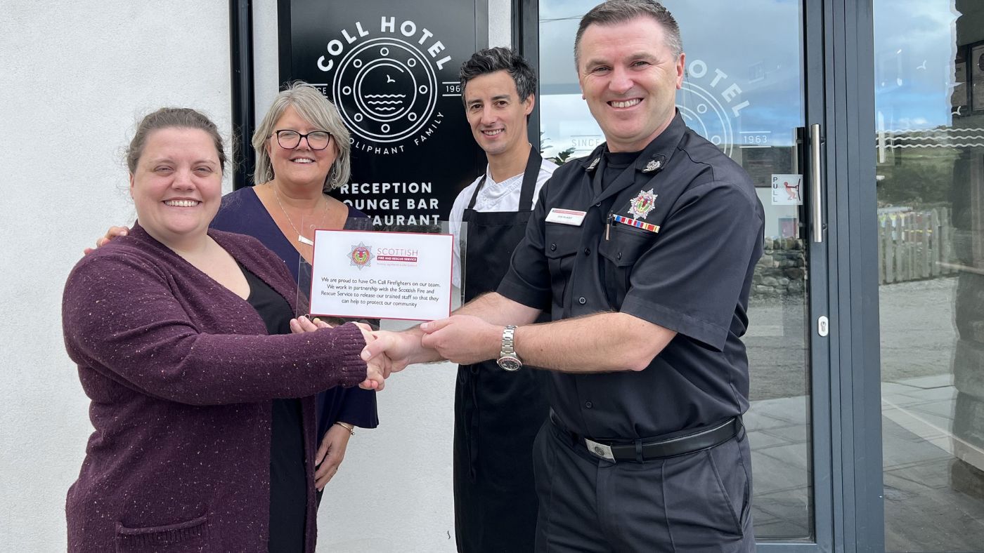 Laura Oliphant, Julie Oliphant, Chef Graham Griffiths, SFRS Joe McKay with an award