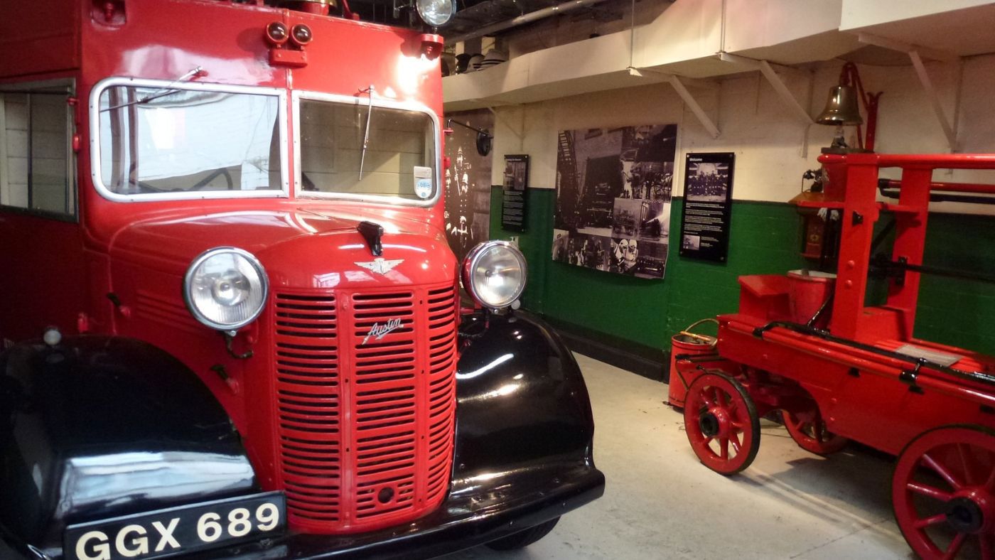 A classic red fire appliance in a museum.